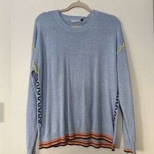 Light Blue Cashmere Crewneck Sweater with colorful detailing.
